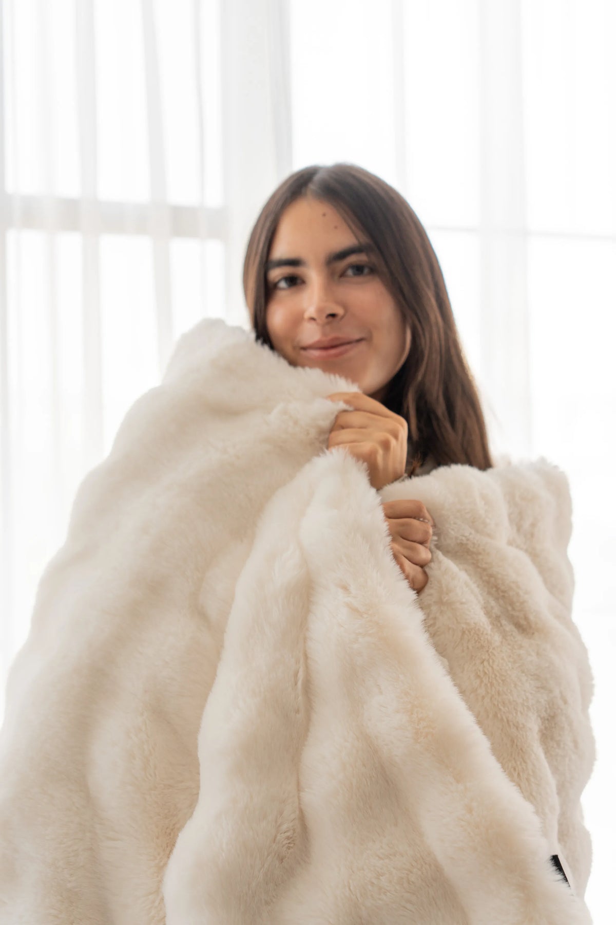 Wrapped in a Cudds faux fur throw